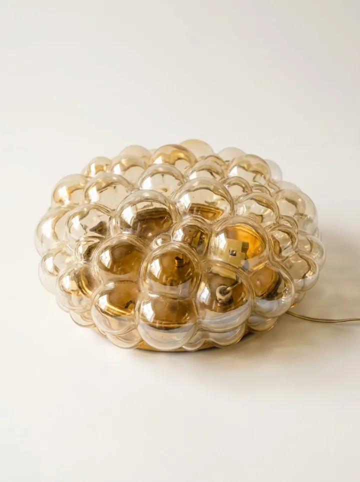 Helena Tynell amber bubble glass flush mount light, front three-quarter view
